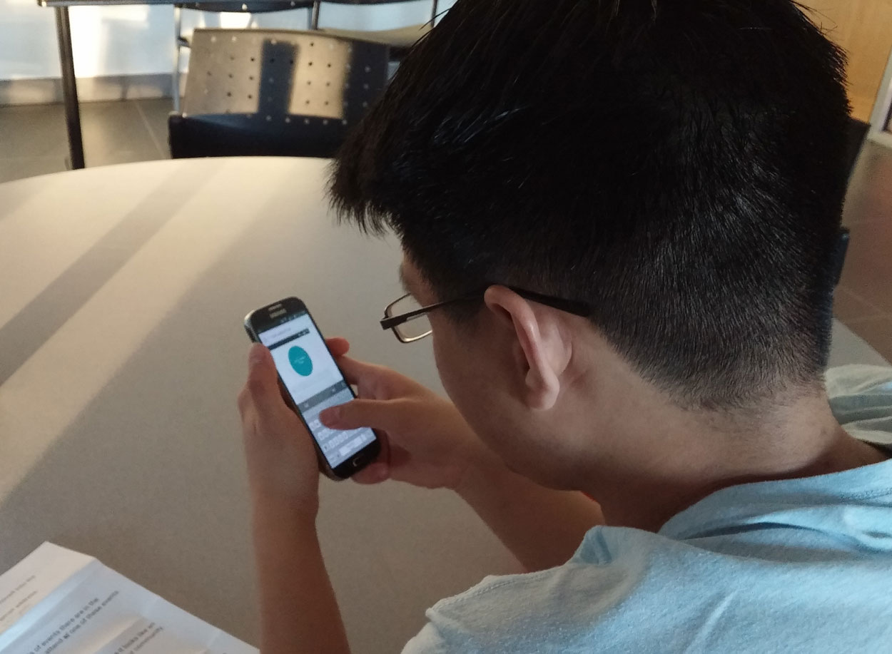 A usability test participant trying out our app